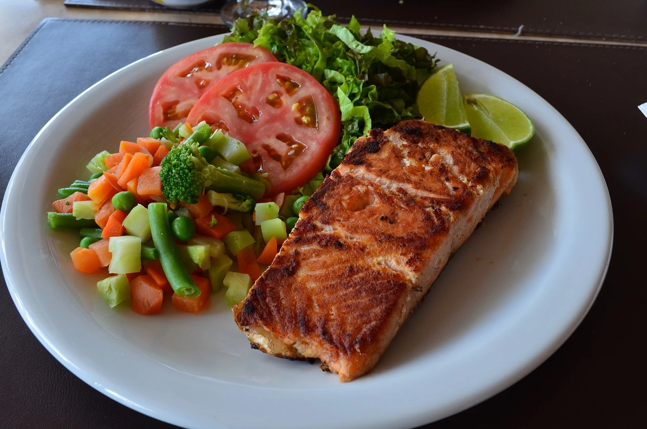 Golden and crispy baked salmon bites served with a fresh lemon wedge